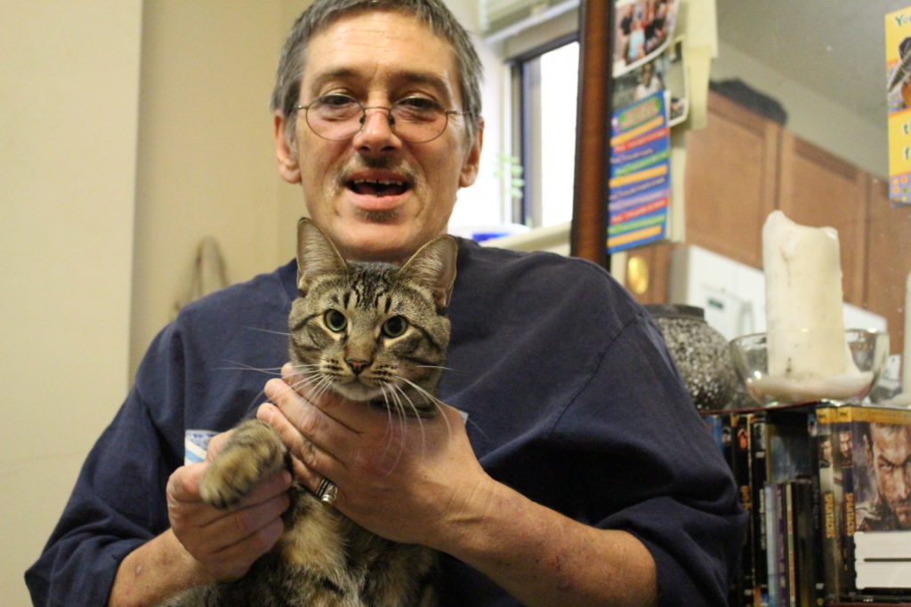A man holding a cat.