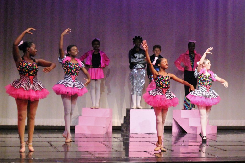 A group of young girls dancing ballet during the Performing Arts Conservatory's final performance in 2018.