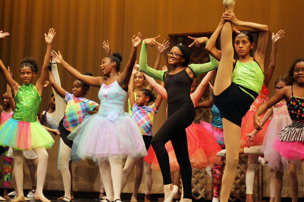 A group of young girls dancing during the Performing Arts Conservatory's final performance in 2019.