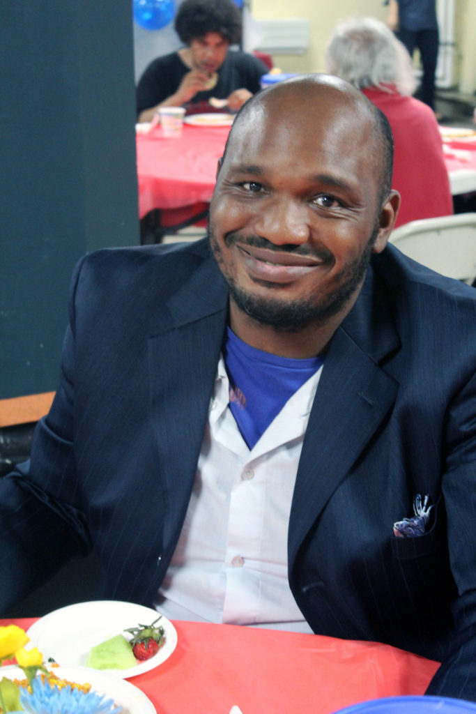 A man sits at a table at a TOP event.