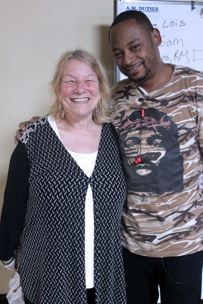 Director of Employment and Rehabilitation Programs Deborah Kaplan stands with a TOP member.