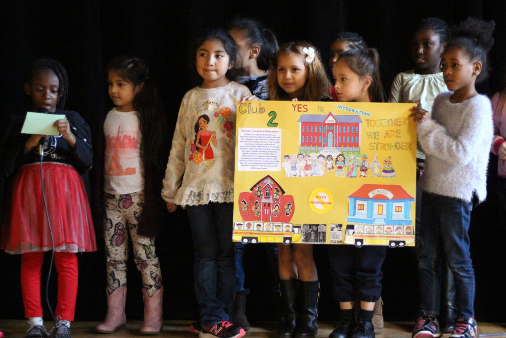 kids presenting a poster