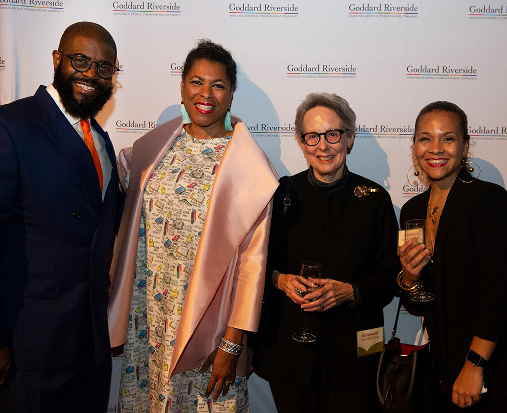 Guests stand in front of the step-and-repeat at the Goddard Riverside 2019 Annual Gala