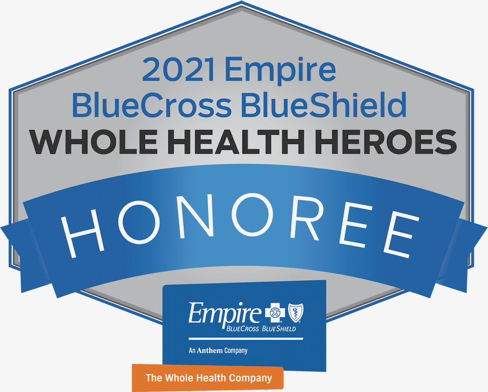 A silver and royal blue badge reading 2021 Empire BlueCross BlueShield Whole Health Heroes Honoree