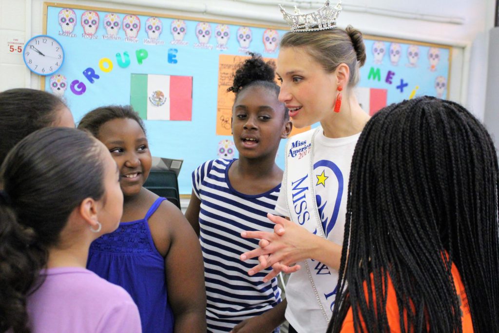 Gabrielle Walter, Miss New York 2017, talks with children at the Bernie Wohl Center
