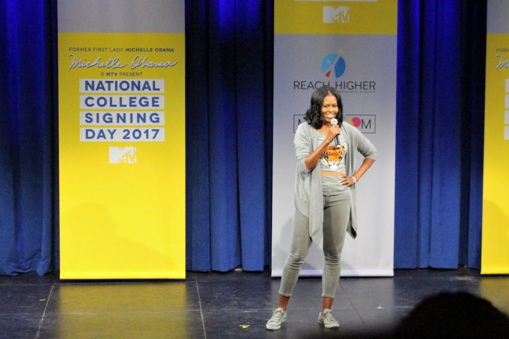 Michelle Obama speaking on stage. 