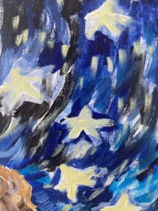 A painting of stars in the sky. The sky is painted with black and blue
