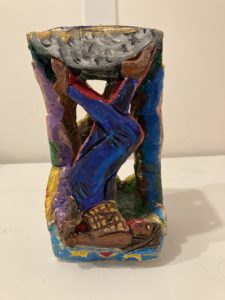 All together now A sculpture of a woman on her back, stretching her legs upwards