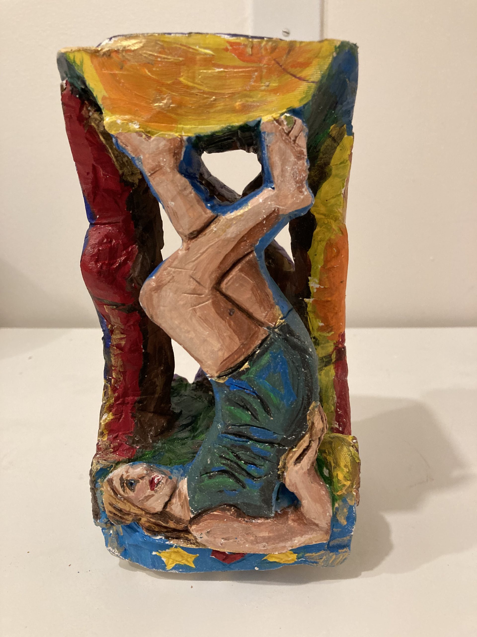 All together now A sculpture of a woman on her back, stretching her legs upwards