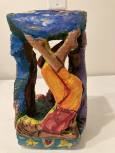 All together now A sculpture of a woman on her back, stretching her legs upwards