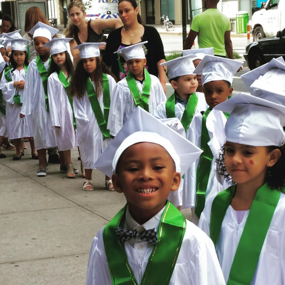 A group of children graduating from the Early Childhood Program.