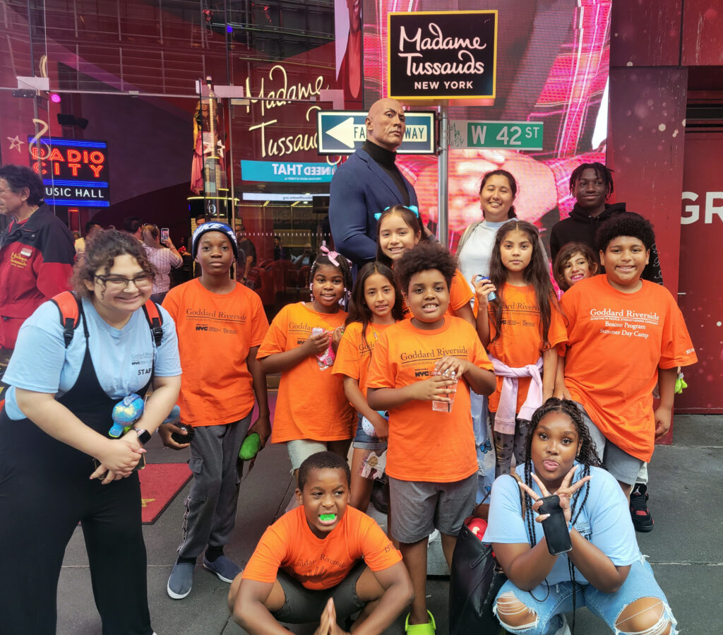 A group of children and staff enjoying the Madame Tussauds museum. 
