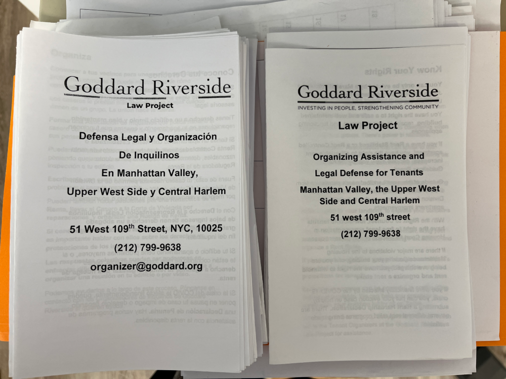 Stacks of flyers for Goddard Riverside Law Project offering legal defense and organizing assistance for tenants in Manhattan Valley, Upper West Side, and Central Harlem. Contains contact details.